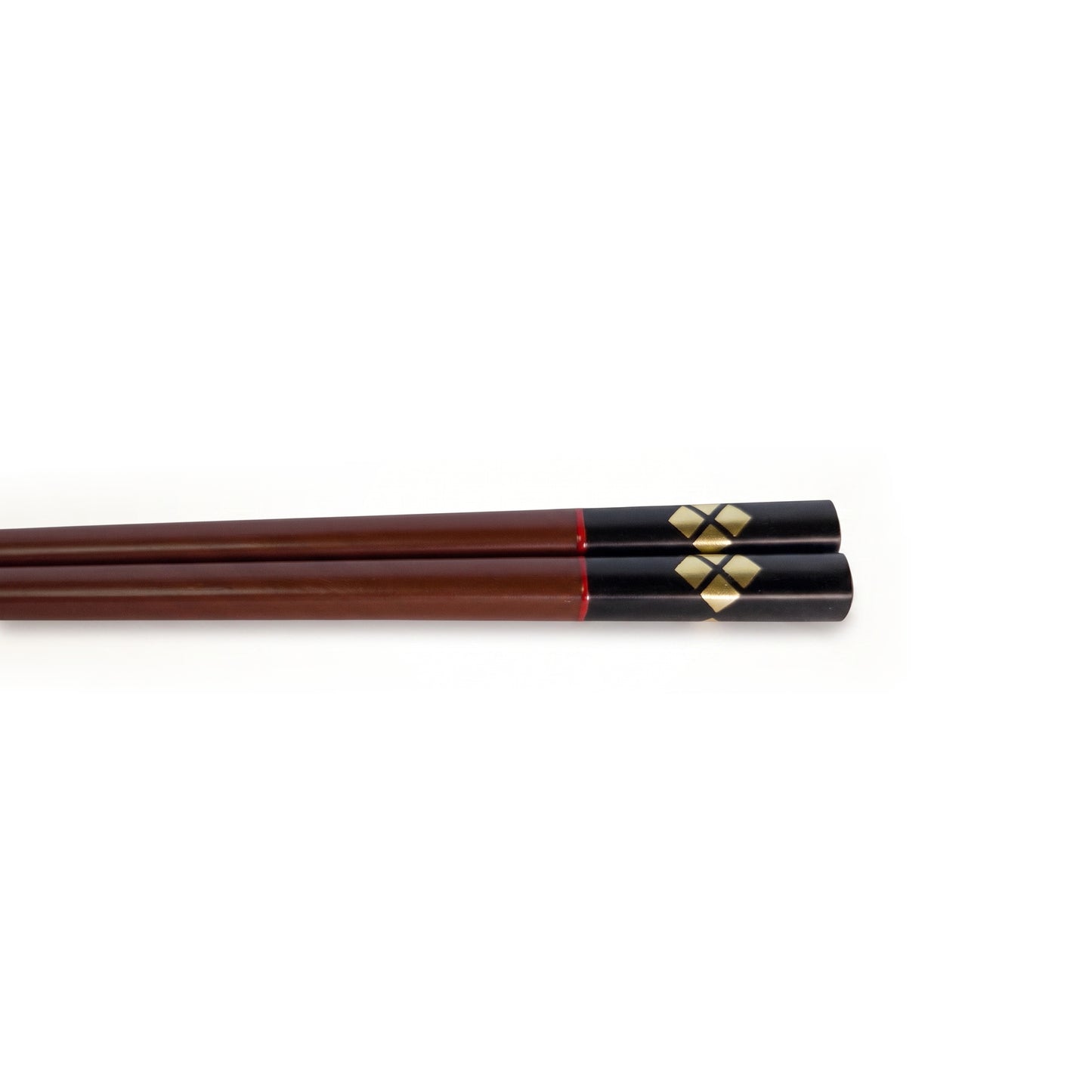 Close view of the bengara pair's handles, gold diamonds set around a dark cross on black lacquer.