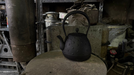 Nanbu ironware tetsubin cast iron kettle with arare pattern from Kamasada workshop, Iwate Prefecture Japan
