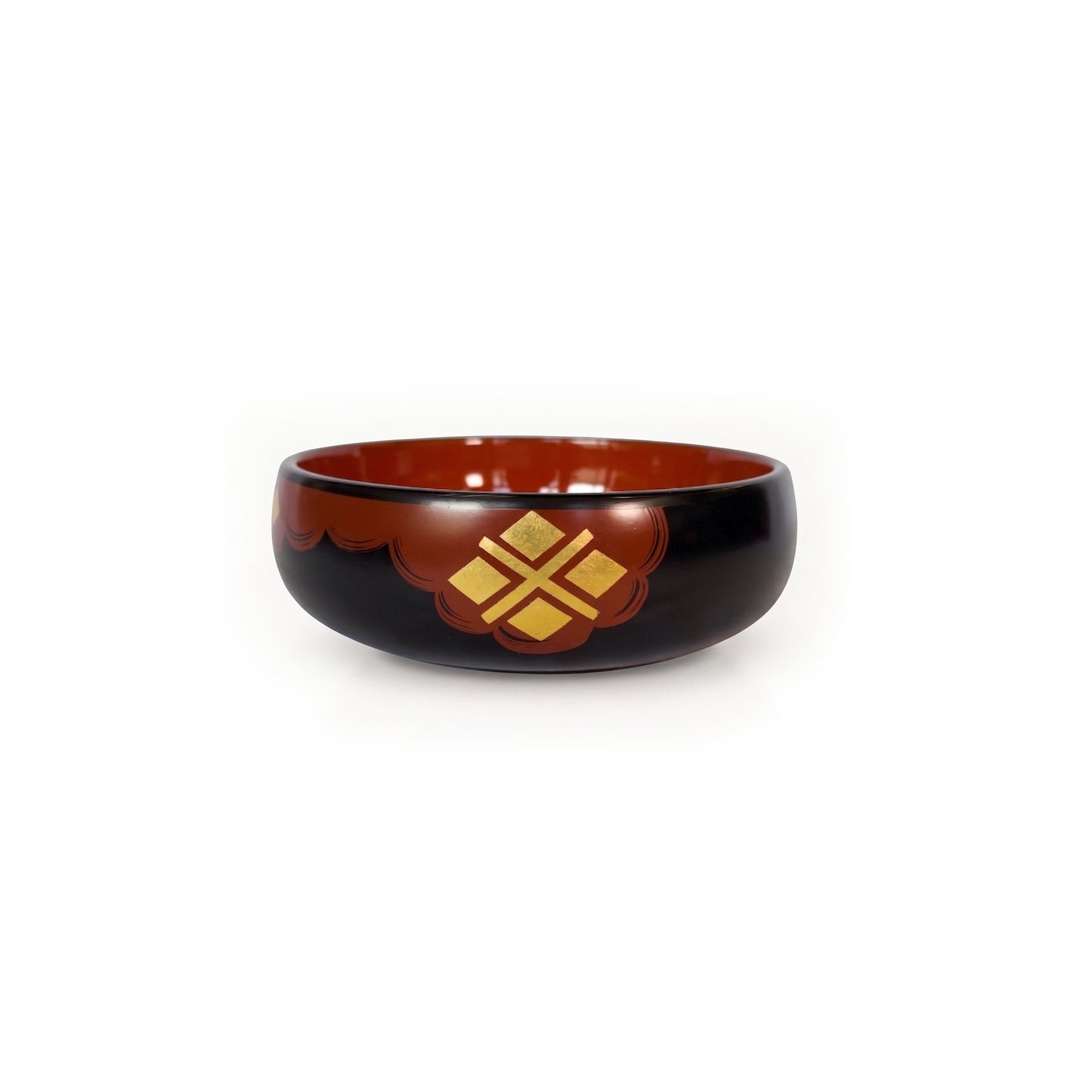 A black lacquer bowl with a deep red interior, a red cloud band across its front holding four gold diamonds in a cross.