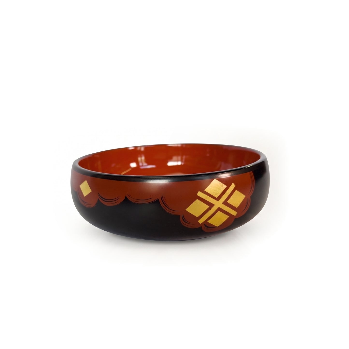 The same bowl angled slightly, the gold four-diamond cross set right of centre on the red band, one lone diamond at the left.