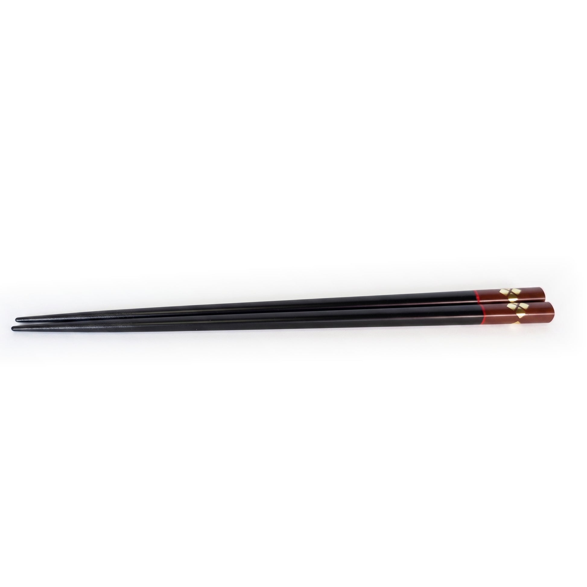 The black pair, the handle end finished in bengara lacquer with gold diamonds, a thin red line where the two meet.