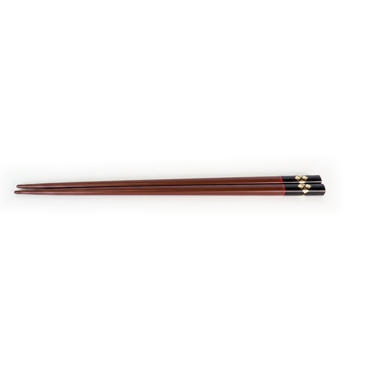 The bengara pair, the handle end finished in black lacquer with gold diamonds, a thin red line where the two meet.