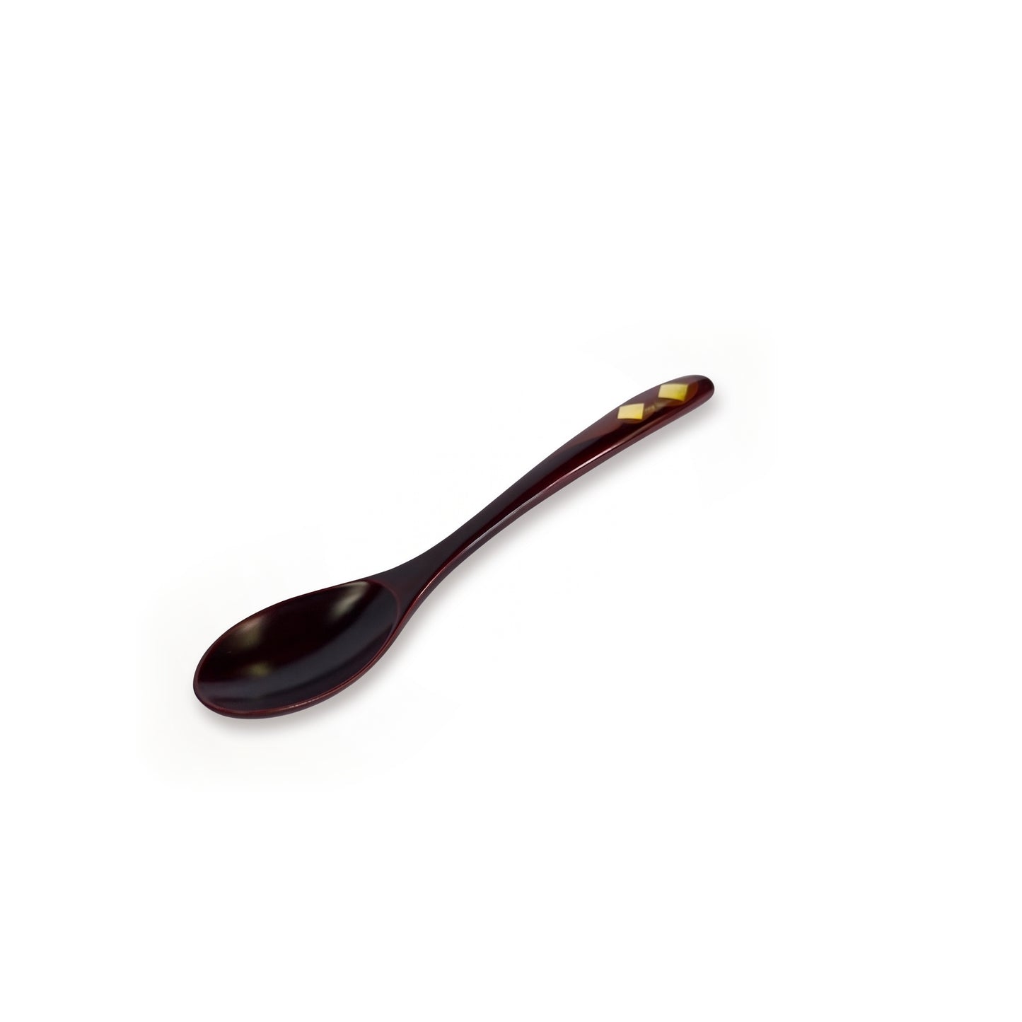 The maroon spoon alone on a diagonal, bowl at the lower left, two gold diamonds set near the raised tip of its handle.